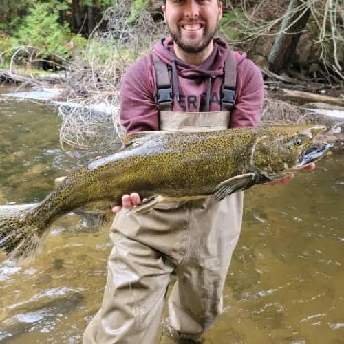 Man holding Chinook salmon