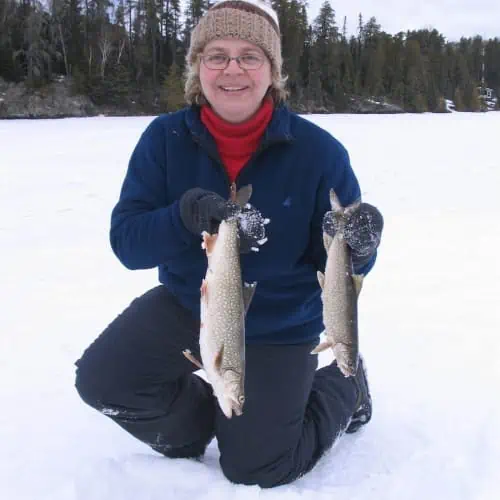 Woman holding lake trout