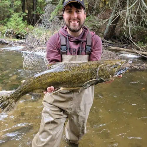 Man holding Chinook salmon