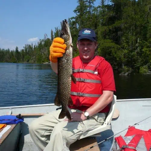 Man holding northern pike