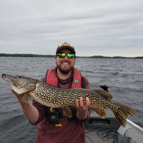 Man holding northern pike