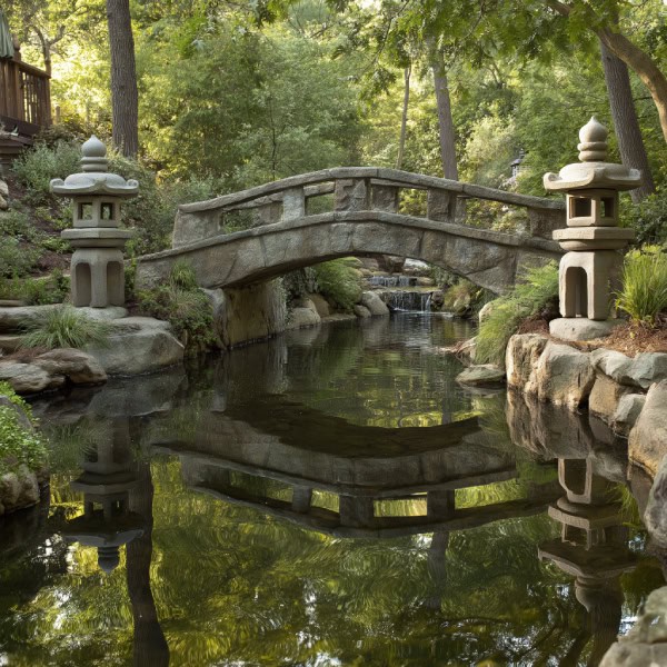 Stone pond bridge with Japanese stone lanterns