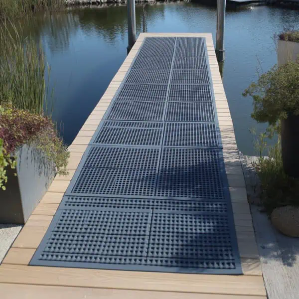 Pond dock decking with non-slip rubber tiles
